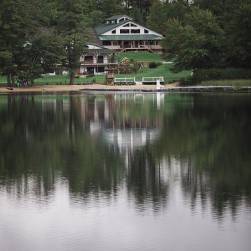 a view of the camp via the lake